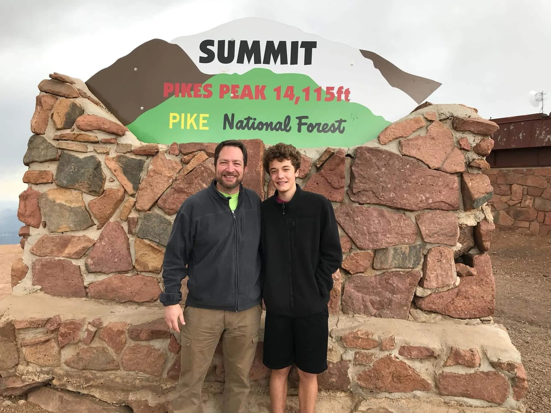 Ric Mere and his son at the summit of Pikes Peak.